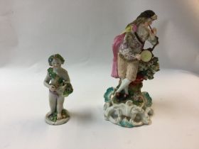 A ceramic cherub and piper figure.