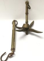 A small brass collapsible anchor and vintage brass salter scales.