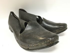 A pair of old leather shoes , postage category B