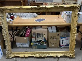 A large early gilt gesso and wooden picture frame.