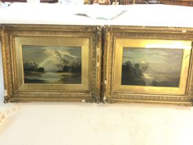 A pair of gilt framed oils on canvas depicting lak
