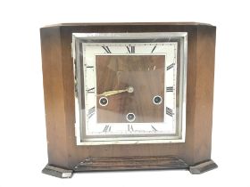 A mahogany 8 day chime and strike clock with key ,