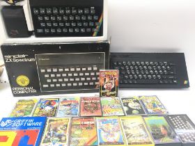 A Boxed Sinclair ZX Spectrum (Board Missing) a Sinclair ZX+ plus Games.
