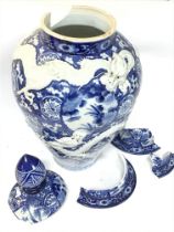 A large damaged Chinese blue and white dragon vase