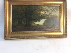 Framed oil painting depicting a scenic landscape i