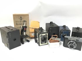 A Collection of cameras including a cased Cosmic 3