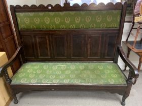 A large inlaid and upholstered settle. 180cm x 150