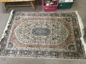 A Persian silk rug , dimensions 186x122cm