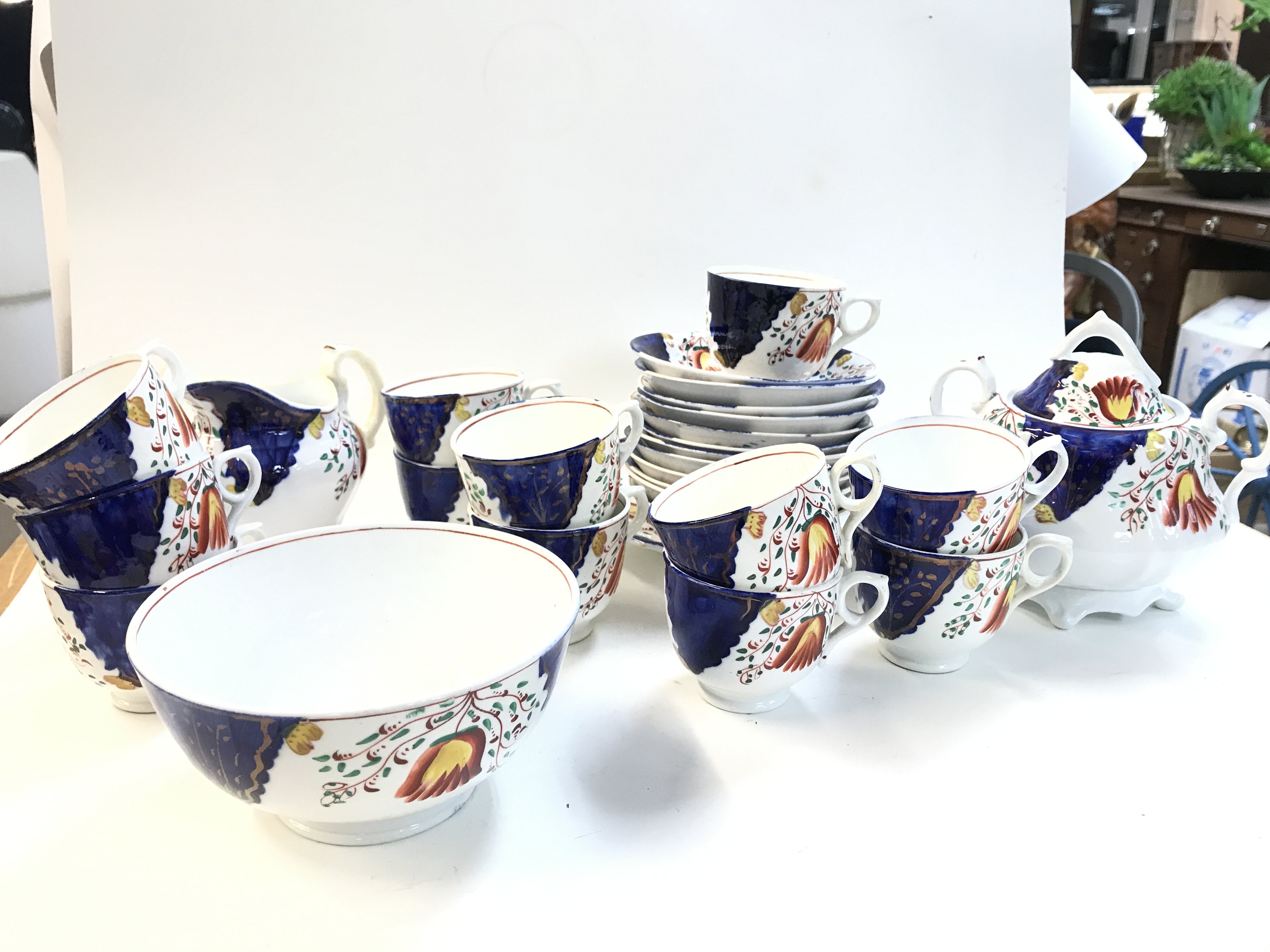 Gaudy Welsh styled porcelain tea set including cups, plates, bowls etc. Postage category D