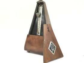 A Wittner wooden metronome. Postage category B