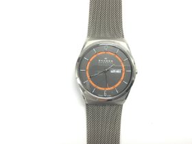 A Skagen wristwatch with day/date aperture. NO RES