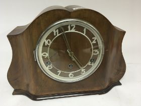 An Art Deco design walnut clock. With three train