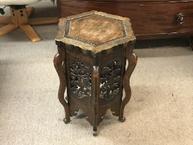A carved oriental table with hexagonal top, approx