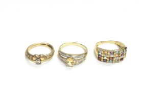 Three 9ct gold rings set with assorted gem stones.