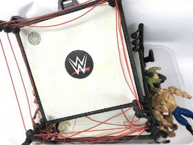 A Collection of WWE toy figures and rings. Postage