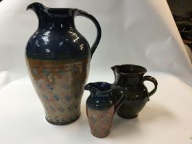 Two jugs stamped with Silvia dales on the bottom and another jug unknown.