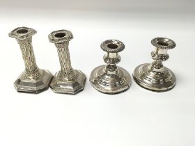 Two pairs of silver plated candle sticks. (B)