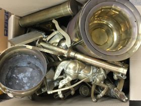 A box containing a quantity of brassware including