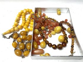 A mixture of amber and resin beads. (A)