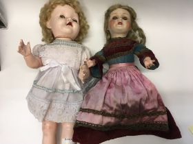 An Early 20th century composition doll with double