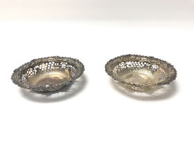 A pair of pierced hallmarked silver dishes. (B)