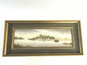 Framed oil painting depicting a lake landscape. No