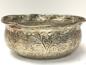 A Burmese silver bowl , 24cm in diameter. Postage