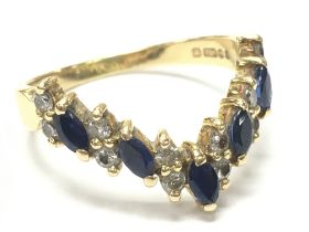 An 18ct gold sapphire and diamond set ring , size