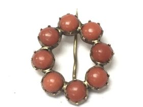 A 9ct gold and coral set brooch , 1.06g. Postage c