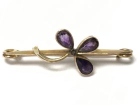 A 9ct amethyst brooch in the form of a flower. Pos