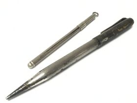 A silver swizzle stick and a silver pencil, postag