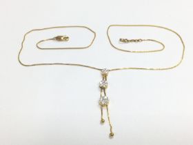 An 18ct gold necklace with three graduated diamond