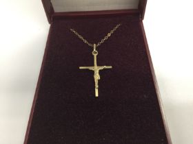 A 9ct gold Elizabeth Duke cross and chain in a fit