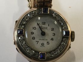 A Art Deco style wrist watch inset with diamonds a