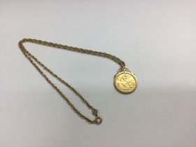 A 1915 half sovereign in a pendant mount with a ch