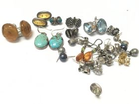 18 pairs of silver earrings, postage category A