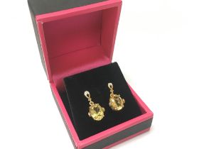 A pair of 9ct gold and citrine earrings. 2.6g Post