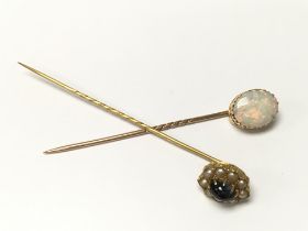 A large Opal set stick pin together with a star sa