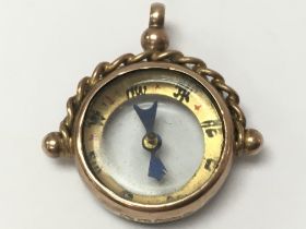 A 9ct gold compass fob, postage category A