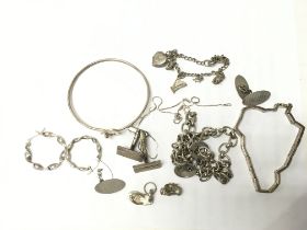 A collection of silver including links of London i