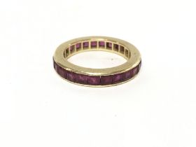 An unmarked high grade gold full eternity ring set