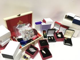 A collection of boxed costume jewellery including