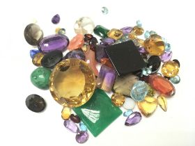 A collection of mixed gemstones. Postage category