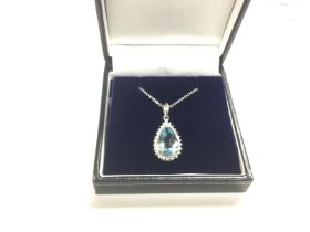 A platinum tear drop pendant set with a pear shape