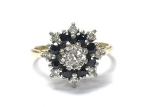 A 18ct Sapphire and diamond cluster ring, size P/Q