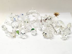 A mixed collection of Swarovski glass figures. Pos