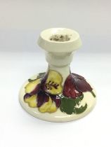 A small Moorcroft candlestick, approx height 8.5cm