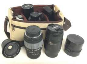 A collection of various SLR lenses including Hanim