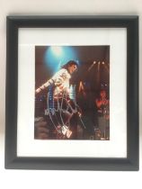 A framed and glazed signed photo of Michael Jackso