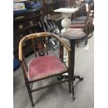 An Edwardian inlaid chair an oak Gothic influence